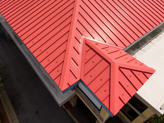 Daytime Drone Images of a Red Metal Standing Seam Metal Roof on a Commercial Building in Raleigh North Carolina: Industry, Engineering, Architecture