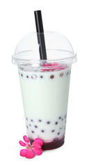 Tasty refreshing bubble tea and flower isolated on white