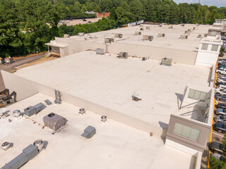 Sunny Daytime Drone Images of TPO Flat Roofs on Commercial and Residential Buildings in Raleigh...