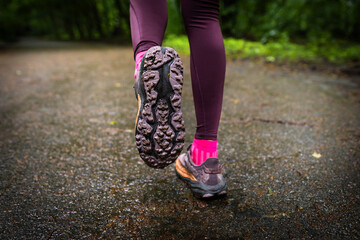 Sports background. A young man runner is ready for a workout in her sports shoes.