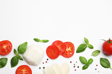 Tasty mozzarella cheese, tomatoes, basil and peppercorns on white background, flat lay. Space for...
