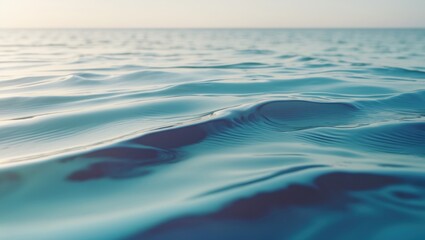 Calm ocean water with gentle ripples and waves, depicting the sea or large body of water.