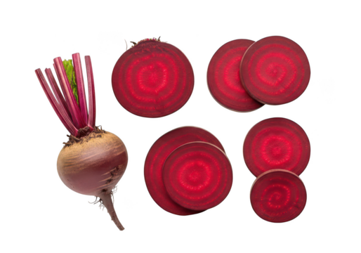Fresh beetroot whole and sliced showing vibrant red rings on vegetable