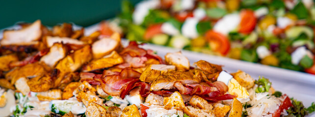 Meat and salad dishes. Plates of various salads. Non vegetarian food banner. Top view. Panorama, banner