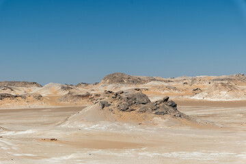 White rock formations and sand dunes in Egypt's White Desert, natural desert landscape	
