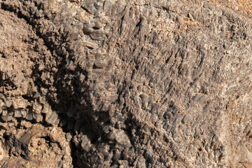 Close-up of a natural quartz formation inside a cave. The detailed crystal structure and layers of the mineral