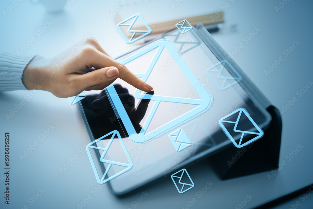 Poster hand touching digital email icon on tablet screen with floating envelope symbols representing online