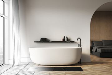 Modern minimalist bathroom with white freestanding bathtub beside large window and bedroom in elegant open space interior concept design rendering. 3D Rendering