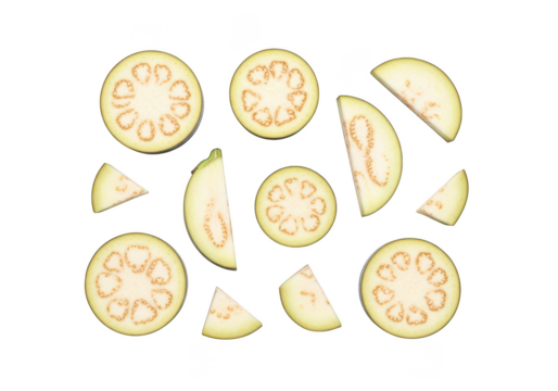 Sliced eggplant rounds and wedges arranged on a vegetable