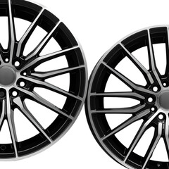 Obraz premium Photo of a Pair of Black and Silver Rims with Black Background