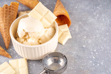 White chocolate ice cream. Portioned bowl with gourmet white chocolate gelato, cold creamy dessert,...