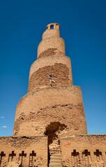 Exploring the ancient spiral minaret in Samarra, Iraq under clear blue skies