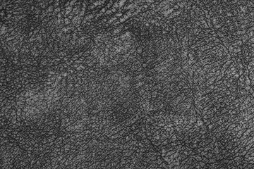 Fototapeta premium Close up, macro of black fabric texture with fine woven fibers and soft textile, cloth structure. Abstract messy background, textile design, upholstery mockup with copy space.