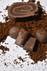 chocolate bars and chocolate products sprinkled by cocoa powder