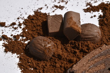 chocolate bars and chocolate products sprinkled by cocoa powder
