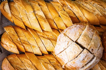 Fresh fragrant breads on the table. Bakery food concept panorama or wide banner photo background