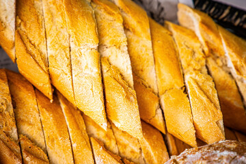 Fresh fragrant breads on the table. Bakery food concept panorama or wide banner photo background