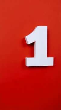 Isolated three dimensional number one against bright red background for graphic design and numerical typography concept.