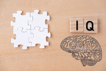 silhouette brain, word IQ, wooden letters, intelligence quotient on wooden background, quantitative...