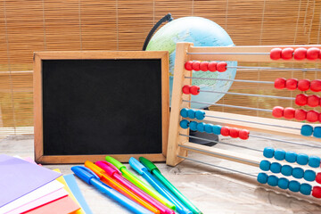 chalkboard surrounded by school supplies, back-to-school concepts or creative learning, School or...