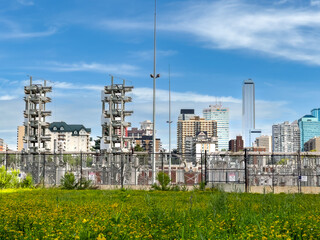 Edmonton skyline with electrical substation and green foreground