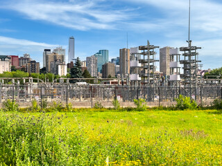 Edmonton skyline with electrical substation and green foreground