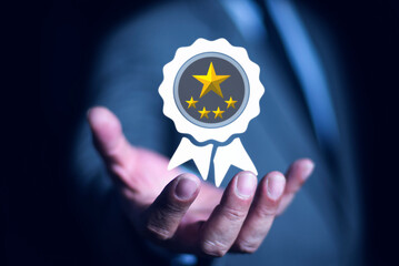 Businessman shows the sign of the top service Quality assurance 5 star, international standard, ISO quality certification and quality guarantee mark.