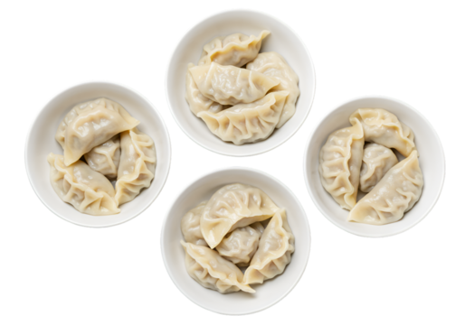 Delicious Dumplings Photo_ Four Bowls of Steamed Dumplings Isolated on Black Background