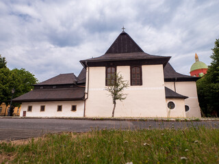 Side view of the wooden Evangelical articular church in Kežmarok, Slovakia, with part of the New...