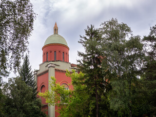 Evangelical church in Kežmarok, Slovakia. Neo-Romanesque architecture with red facade, green roof...