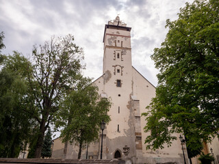 Basilica of the Holy Cross in Kežmarok, Slovakia. Historic Roman Catholic church with tall tower,...
