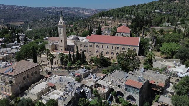 
 Panoramic aerial view of Ein Karem village near Jerusalem with famous landmark Franciscans catholic Church of Saint John the Baptist built on the place where he was born  , video footage