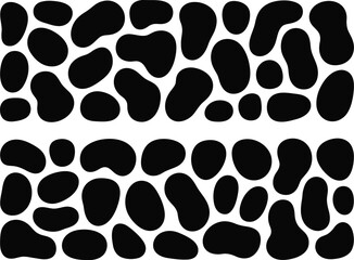 Black and white cow with black spots on it