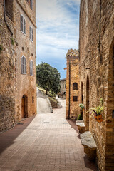Fototapeta premium Old mediaval empty street in the historic Tuscan town of San Gimignano, Italy