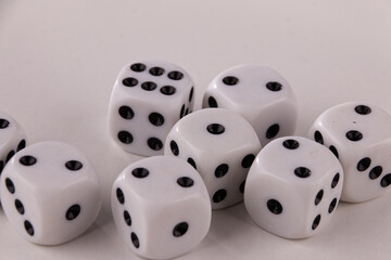 A random arrangement of dice and a puzzle cup, captured after the dice have been cast.