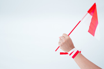 Hand Holding Indonesian Flag
