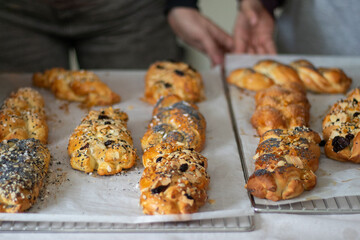 Fresh sweet pastries on baking sheets just from the oven