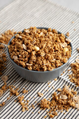 Healthy Homemade Toasted Muesli with Nuts in a Bowl, side view.