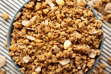 Healthy Homemade Toasted Muesli with Nuts in a Bowl, top view. Close-up.