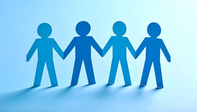 Paper people holding hands as a symbol of unity and teamwork
