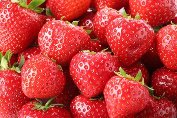 Fresh ripe strawberries as background, closeup view