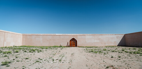 Ancient architecture stands in Samarra, Iraq surrounded by arid land and blue sky