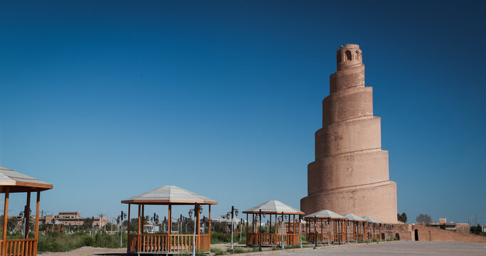 Historic spiral minaret stands tall in Samarra Iraq under clear blue sky