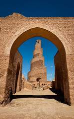 Historic minaret view at Al Askari Mosque site in Samarra Iraq under clear blue sky