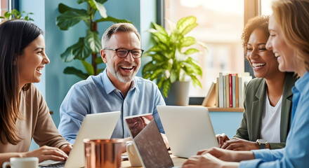 Diverse Colleagues Share a Laugh During Collaborative Project In Bright Modern Office