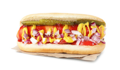 Tasty hot dog with pickles, onion, ketchup and mustard isolated on white