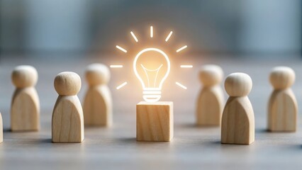 Lightbulb icon glowing at the center of group blocks — collective team creativity spark
