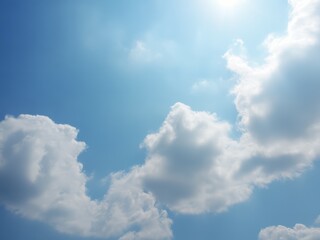 Bright sky with fluffy clouds blue white