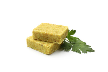 Aromatic bouillon cubes and parsley isolated on white