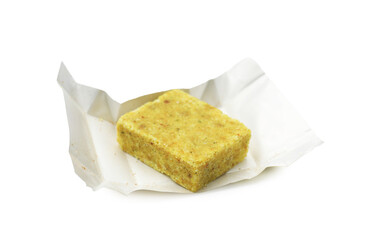 One aromatic bouillon cube isolated on white